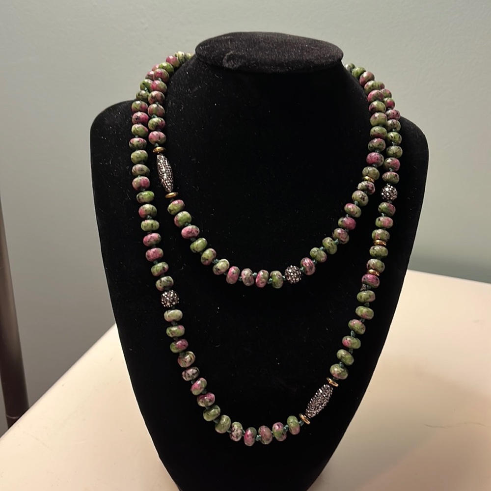 N66. Long green stone necklace with black sparkly beads.